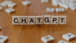 chatgpt spelled with wooden letter tiles on table